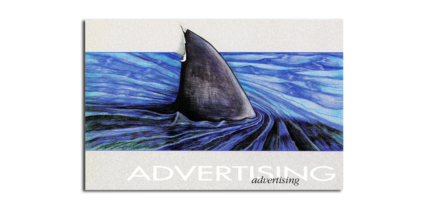 Shark fin in the ocean advertising his presence